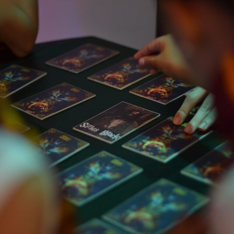 Participants’ hands beside character cards during a Monkey Donkey game.